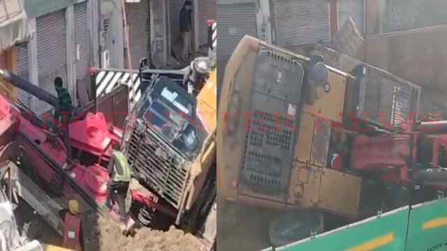निर्माण के दौरान 25 फीट ऊंचाई से घर पर गिरी क्रेन, शराब की दुकान चकनाचूर, देखें वीडियो
